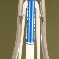 Custom Blend Titanium Cross Frame & Alpha QCX20 Fork. Custom White Powdercoat with Blue Panels.