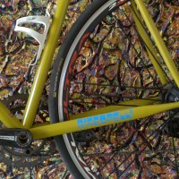 The bikes riding great. So smooth and compliant. Even though I’ve been riding in some pretty hot weather, the bike’s “zen-like” ride takes my mind to a “cooler” place.The bike is pictured in these photos in front of a couple of big abstract acrylic paintings that I did.