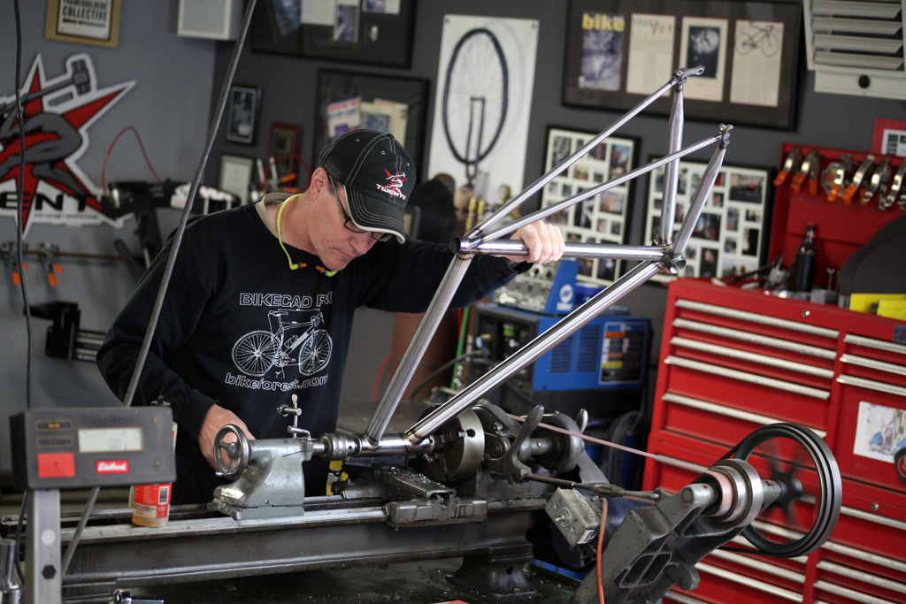 Here I am machining a head tube on a dedicated reamer/facer. An environmentally friendly cutting fluid is used for all of our operations.