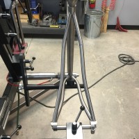 Titanium gravel bike with S-bend stays and setup for Di2 internal wires.