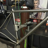 Titanium gravel bike with S-bend stays and setup for Di2 internal wires.