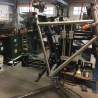 Titanium road bike designed for large tire clearance with long reach caliper brakes.