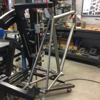 Titanium road bike designed for large tire clearance with long reach caliper brakes.