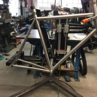 Titanium road bike designed for large tire clearance with long reach caliper brakes.