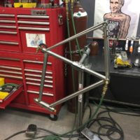 Titanium road bike. Flat mount disc brakes, tapered headtube with internal bearings and Syntace dropouts.