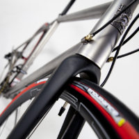 Custom Blend titanium disc road bike. Featuring Campy Record with H11 brakes and cranks along with a Columbus Futura fork, internal headset and Enve cockpit.