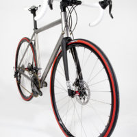 Custom Blend titanium disc road bike. Featuring Campy Record with H11 brakes and cranks along with a Columbus Futura fork, internal headset and Enve cockpit.