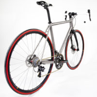 Custom Blend titanium disc road bike. Featuring Campy Record with H11 brakes and cranks along with a Columbus Futura fork, internal headset and Enve cockpit.